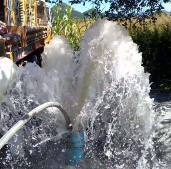 Water discharging from a borehole during deepening work.