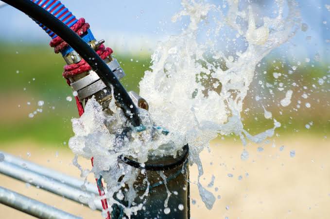 Water flushing from borehole pipework.